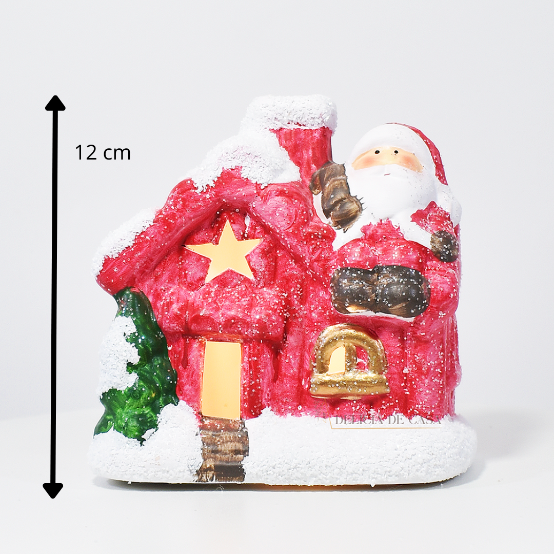 Casinha decorativa de Natal com Papai Noel e neve, feita em resina com glitter e luz interna, 12 cm de altura, nas cores bege, vermelho e cinza.