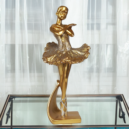 Escultura decorativa de bailarina dourada em resina em pose de ballet sobre base elegante