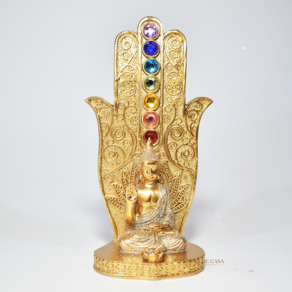 Incensário dourado em formato de mão com pedras coloridas dos 7 chakras e imagem de Buda em posição de meditação, usado para aromaterapia, decoração e equilíbrio energético