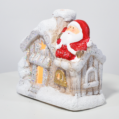 Casinha decorativa de Natal com Papai Noel e neve, feita em resina com glitter e luz interna, 12 cm de altura, nas cores bege, vermelho e cinza.