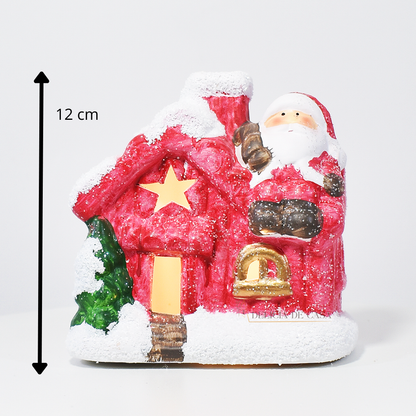 Casinha decorativa de Natal com Papai Noel e neve, feita em resina com glitter e luz interna, 12 cm de altura, nas cores bege, vermelho e cinza.