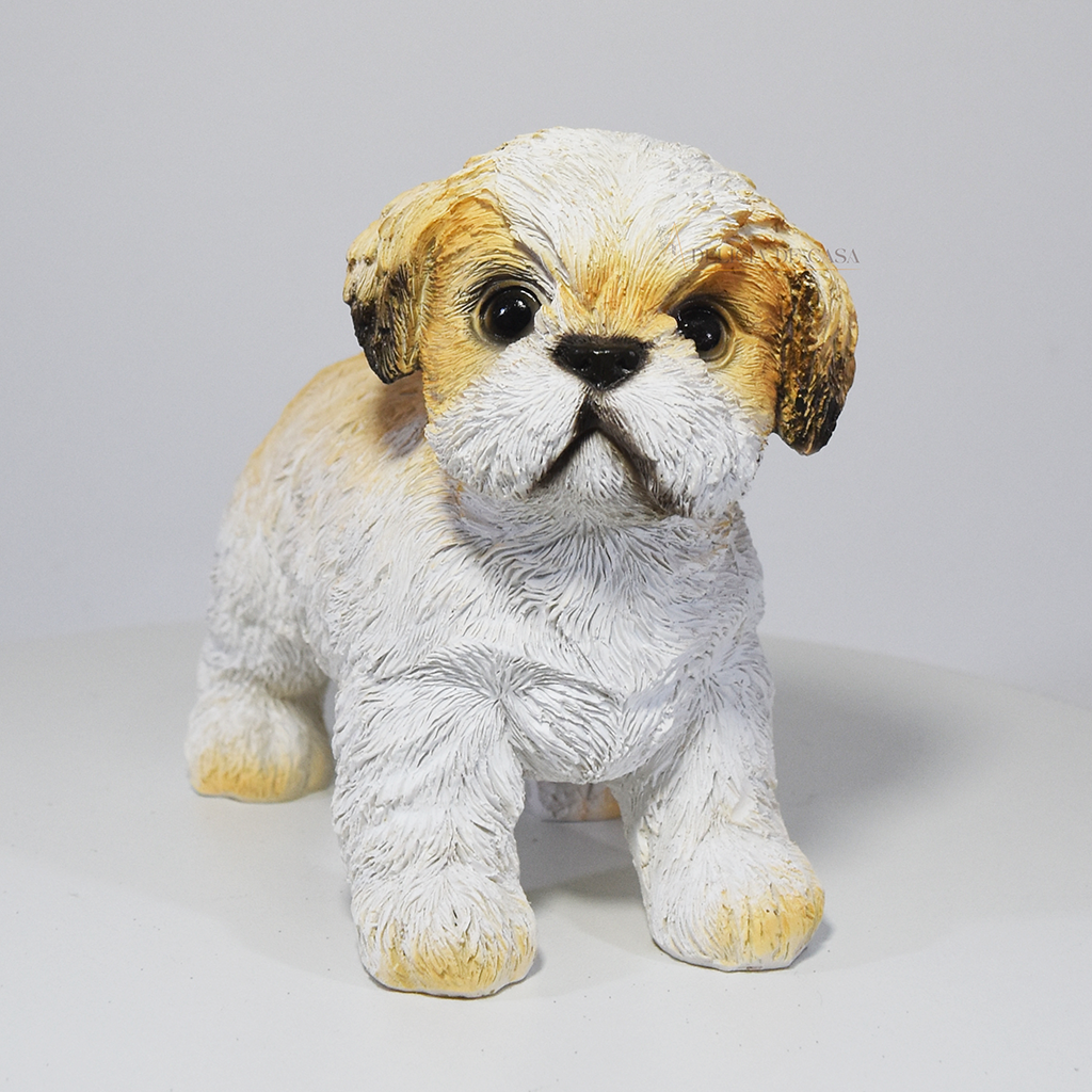 Esculturas decorativas de cachorros em resina representando as raças Labrador, Shih Tzu e Cavalier King Charles Spaniel, ideais para decoração ou presente.