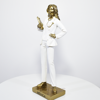 Estátua decorativa de médica em resina dourada e branca, ideal para presente e decoração de clínica médica ou consultório.