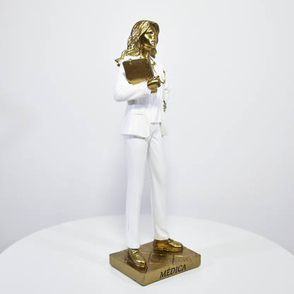 Estátua decorativa de médica em resina dourada e branca, ideal para presente e decoração de clínica médica ou consultório.
